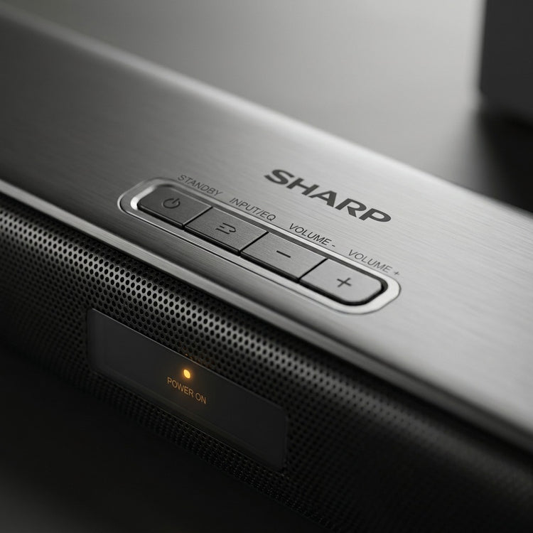 Close-up of the SHARP HT-SBW192 sound bar’s brushed metal top, tactile buttons, and LED indicator.