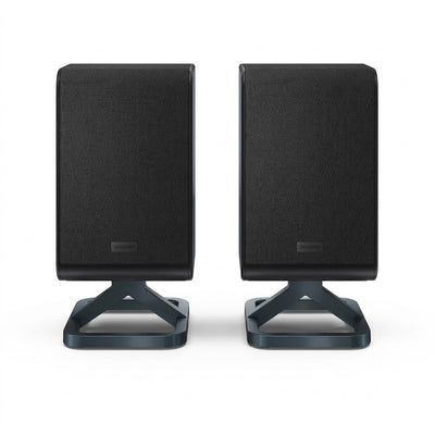 Pair of black Sharp HT-SPR52021-BK wireless rear surround speakers on modern stands, pure white background.